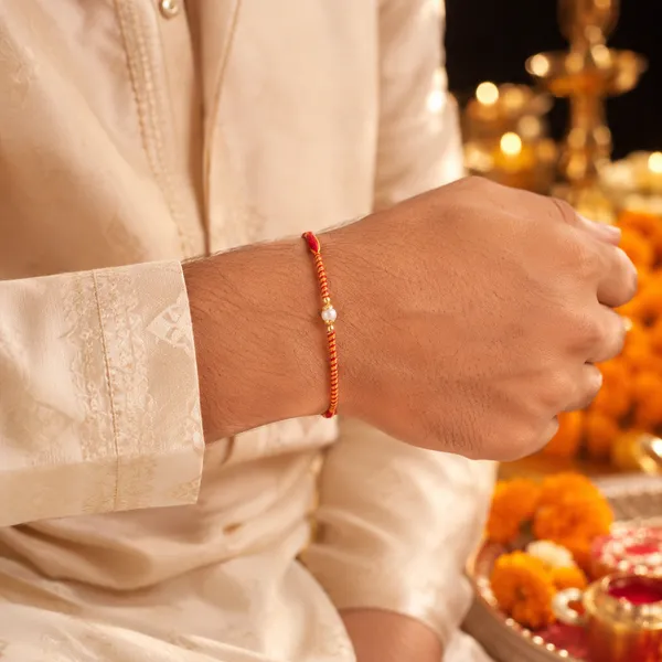 Orange_And_Red_Thread_Rakhi_With_Pearl_Bead_Pack_Of_6