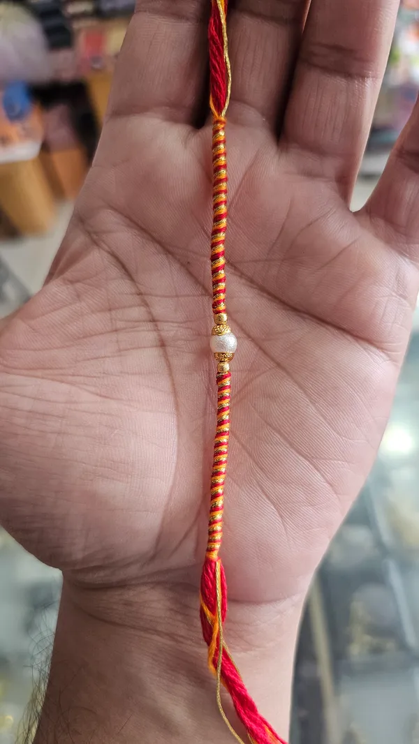 Orange_And_Red_Thread_Rakhi_With_Pearl_Bead_Pack_Of_6