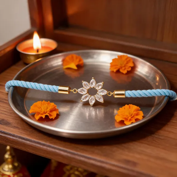 Turquoise_Cord_Gold_Flower_Charm_Rakhi