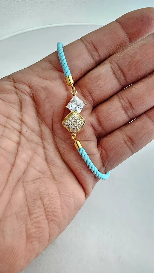Turquoise_Corded_Gold_Studded_Charm_Rakhi