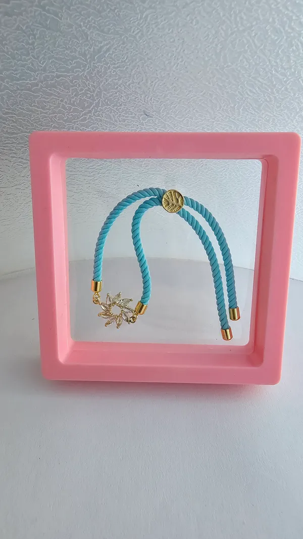 Turquoise_Cord_Gold_Flower_Charm_Rakhi
