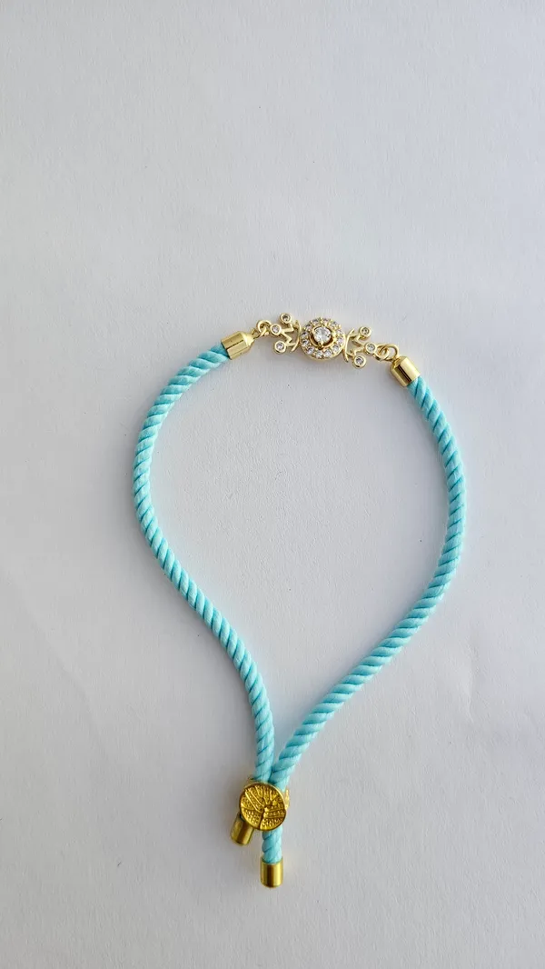 Turquoise_Thread_Gold_Toned_Rakhi_With_Crystal_Charm