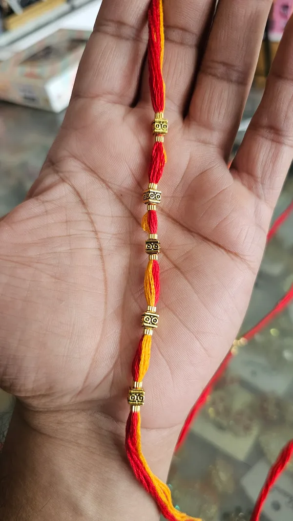 Red_And_Yellow_Twisted_Thread_Rakhi_With_Golden_Beads_Pack_Of_4