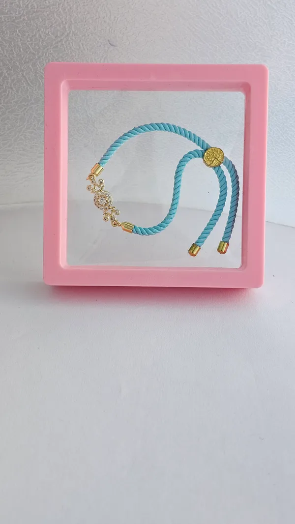Turquoise_Thread_Gold_Toned_Rakhi_With_Crystal_Charm