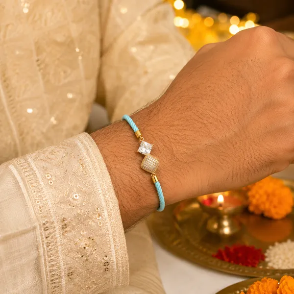 Turquoise_Corded_Gold_Studded_Charm_Rakhi