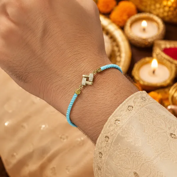 Turquoise_Cord_Gold_Charm_Adjustable_Rakhi