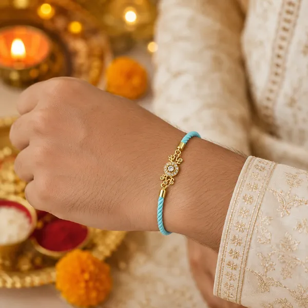 Turquoise_Thread_Gold_Toned_Rakhi_With_Crystal_Charm