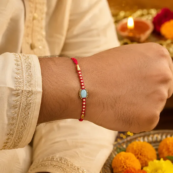 Red_Thread_Rakhi_With_Pearl_And_Stone_Embellishments_Pack_Of_4
