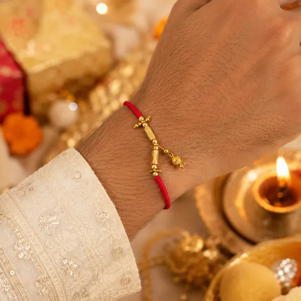 Gold_Plated_Sword_Charm_Red_Thread_Rakhi_Rakhi_Pack_Of_4