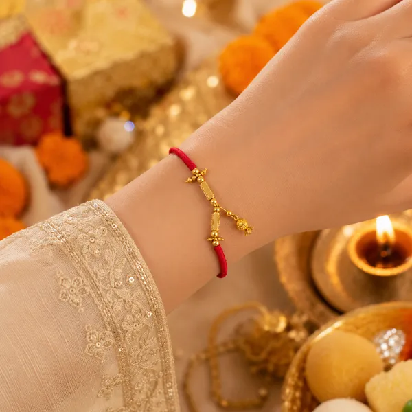 Gold_Plated_Sword_Charm_Red_Thread_Rakhi_Rakhi_Pack_Of_4