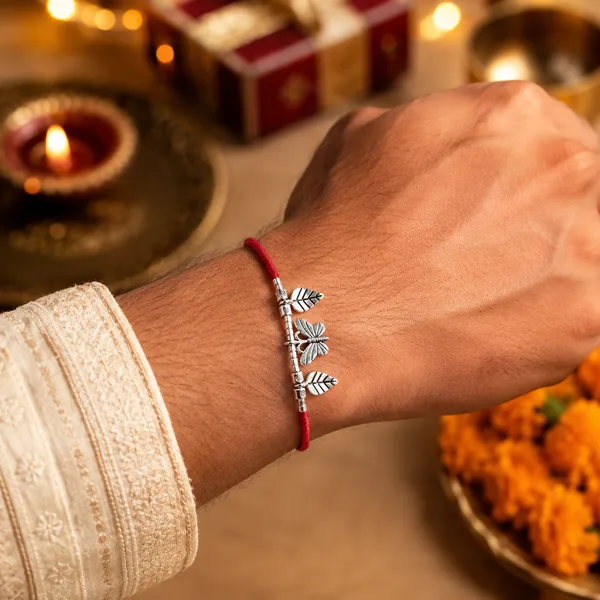 Silver_Leaf_And_Butterfly_Charm_Rakhi_With_Red_Thread_Pack_Of_3
