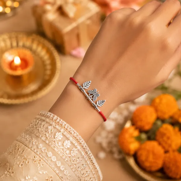 Silver_Leaf_And_Butterfly_Charm_Rakhi_With_Red_Thread_Pack_Of_3