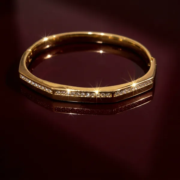 Gold_octagonal_hinged_bangle_-_Hinged_bangle_-_Channel-set_CZ_stone_row