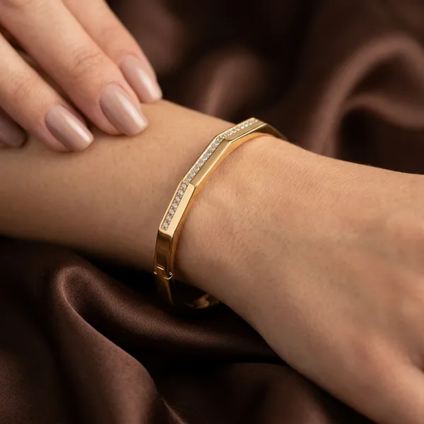 Gold_octagonal_hinged_bangle_-_Hinged_bangle_-_Channel-set_CZ_stone_row
