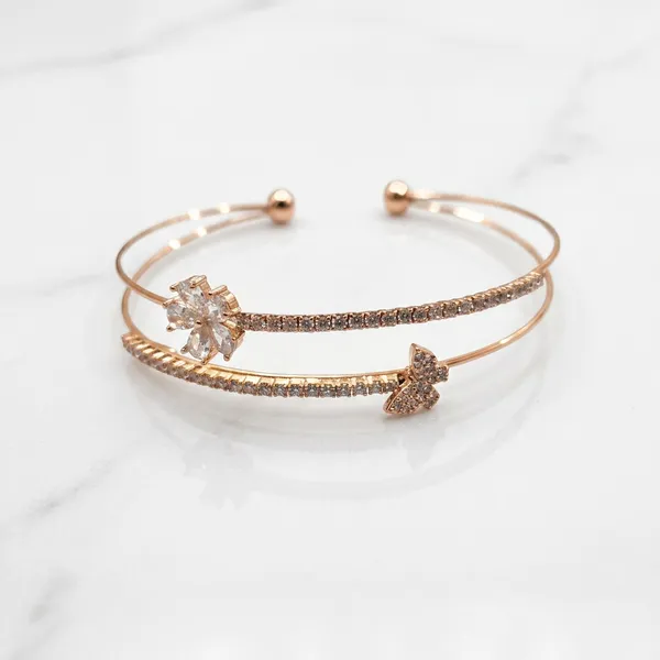 Rose_gold_open_cuff_double_bangle_-_Open_cuff_-_Diamond-cut_texture+butterfly_charm