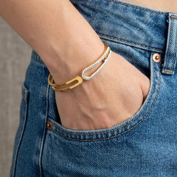 Gold_geometric_open-frame_bangle_-_Hinged_bangle_-_Double_CZ_bar+cut-out_design