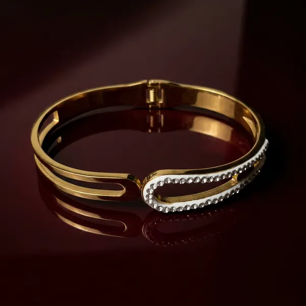 Gold_geometric_open-frame_bangle_-_Hinged_bangle_-_Double_CZ_bar+cut-out_design