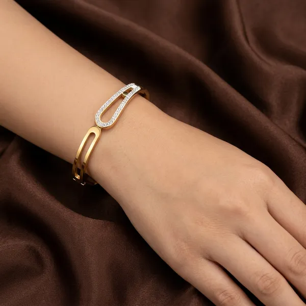 Gold_geometric_open-frame_bangle_-_Hinged_bangle_-_Double_CZ_bar+cut-out_design