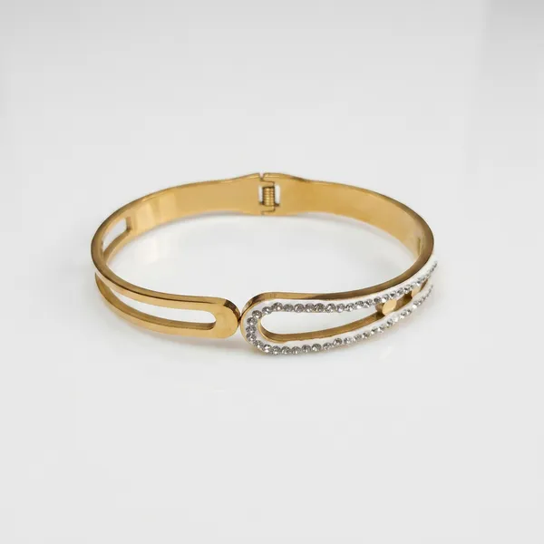 Gold_geometric_open-frame_bangle_-_Hinged_bangle_-_Double_CZ_bar+cut-out_design