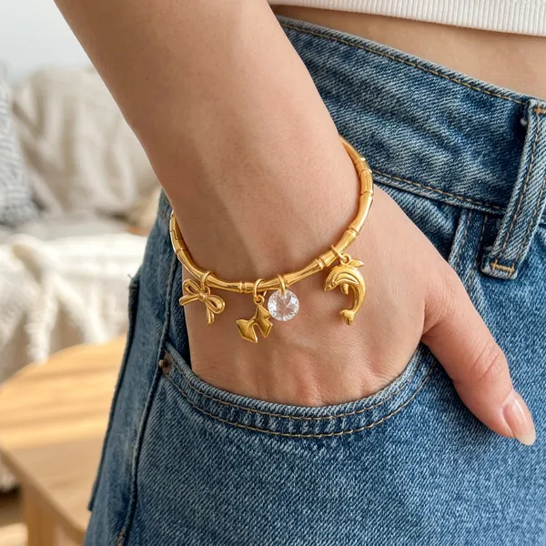 Gold_Plated_Bamboo_Bracelet_With_Charms_(Bow+Star+Crystal+Dolphin)