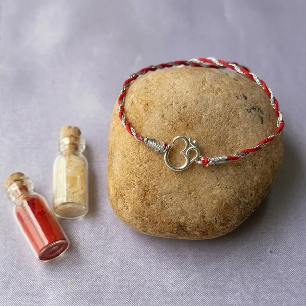 925_Silver_Red_And_White_Thread_Om_Rakhi_With_Roli_Chawal_Glass_Bottle_And_Happy_Rakhi_Card
