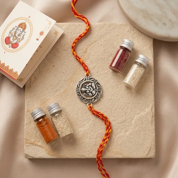 Silver_Sun_Thread_Rakhi_For_Brother_With_Kumkum_Chawal_Bottle_And_Greeting_Card