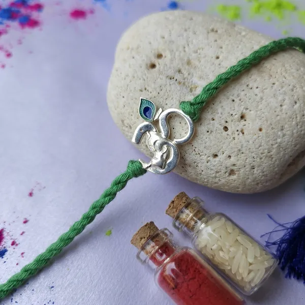 925_Silver_Om_Charm_Green_Thread_With_Roli_Chawal_Glass_Bottle_And_Happy_Rakhi_Card