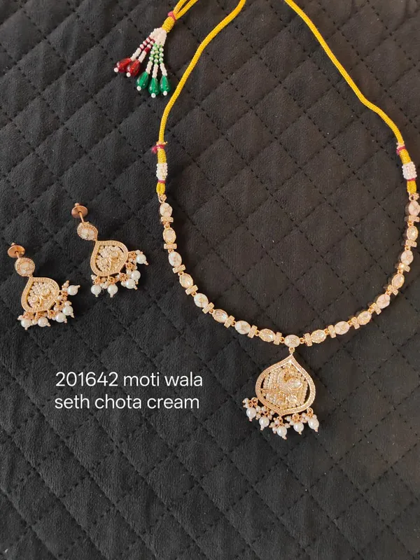 Gold_And_Cream_Kundan_Pearl_Brass_Necklace_Set_For_Women