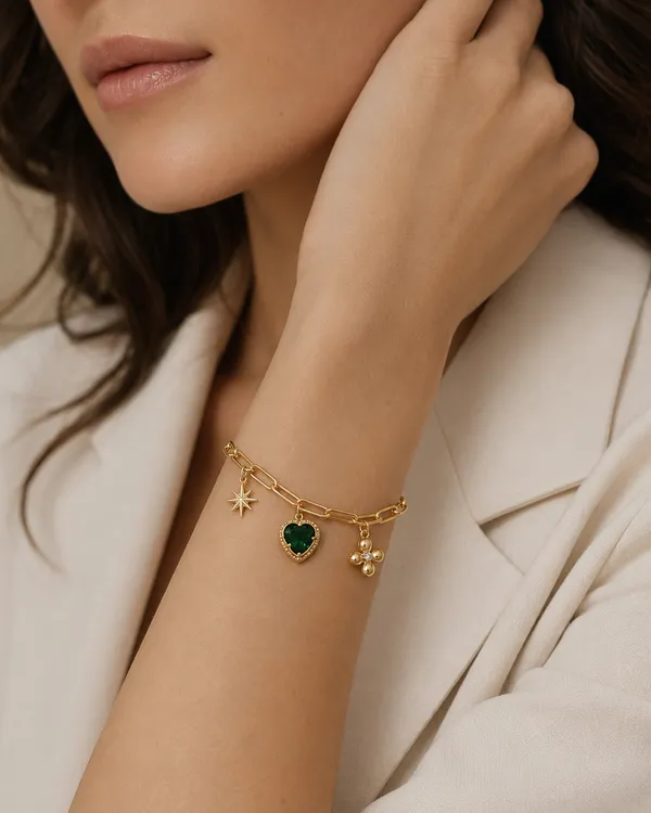 Gold_Charm_Bracelet_with_Green_Heart_Stone_Star_and_Floral_Charms