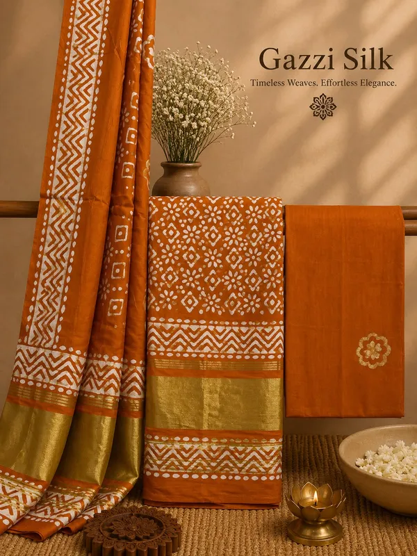 Rust_Gazzi_Silk_Batik_Print_Unstiched_Salwar_Suit_with_Golden_Border_For_Women