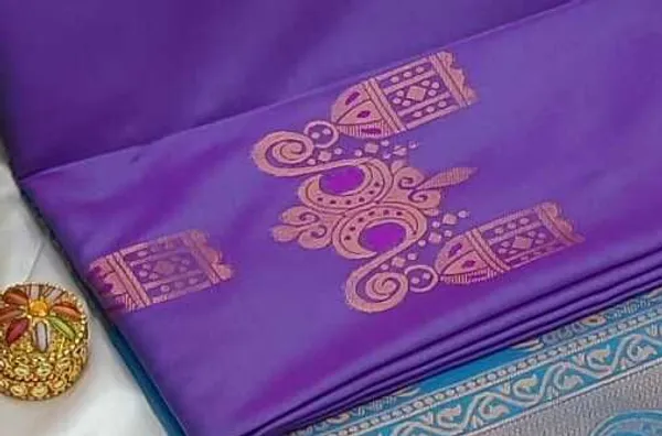 Banarasi_Kanjeevaram_Silk_Saree_with_Rich_Zari_Weaving_and_festive_and_wedding_wear_And_Party_Wear_collection_With_Tassels_Latkan_And_Blouse_Piece