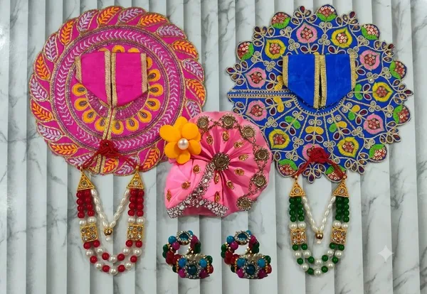 Laddu_Gopal_Poshak_Combo_Set_Size_5_-_Includes_2_Poshaks,_1_Mukut,_1_Mala,_and_1_Kada_Jodi_Assorted_Colors,_Same_Design