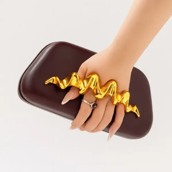 Veloure_Zephyr_Statement_Clutch_-_Burgundy_Bag_With_Gold_Wave_Handle