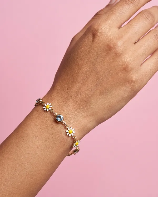Gold_Toned_Daisy_Charm_Bracelet_With_Crystal_Accents_