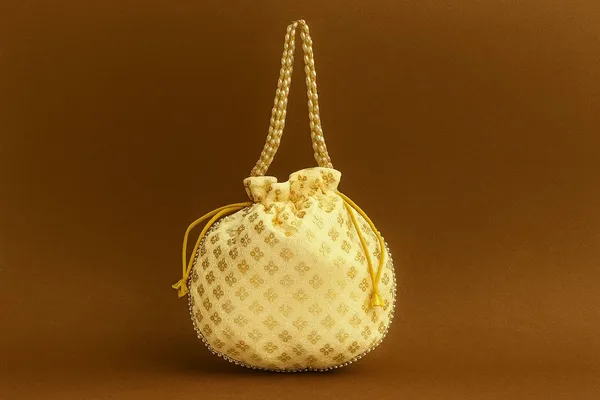 Handcrafted_Silk-Blend_Potli_Bag_with_Golden_Zari_Motifs_&_Pearl_Handle-Cream