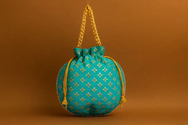Handcrafted_Silk-Blend_Potli_Bag_with_Golden_Zari_Motifs_&_Pearl_Handle-Blue