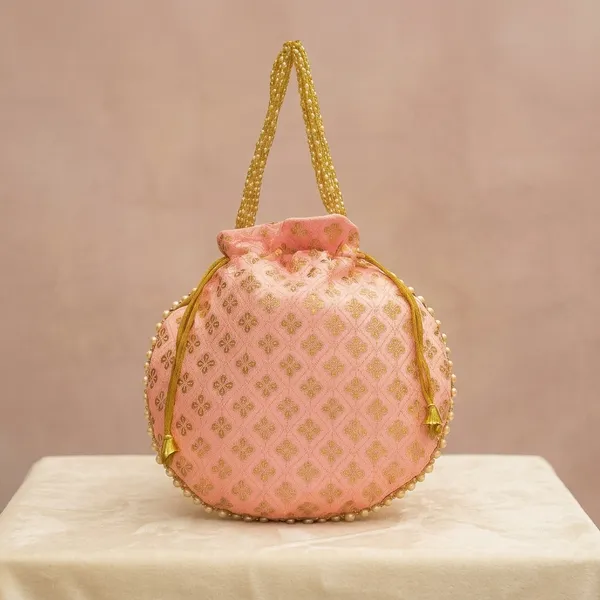 Handcrafted_Silk-Blend_Potli_Bag_with_Golden_Zari_Motifs_&_Pearl_Handle-Light_Pink