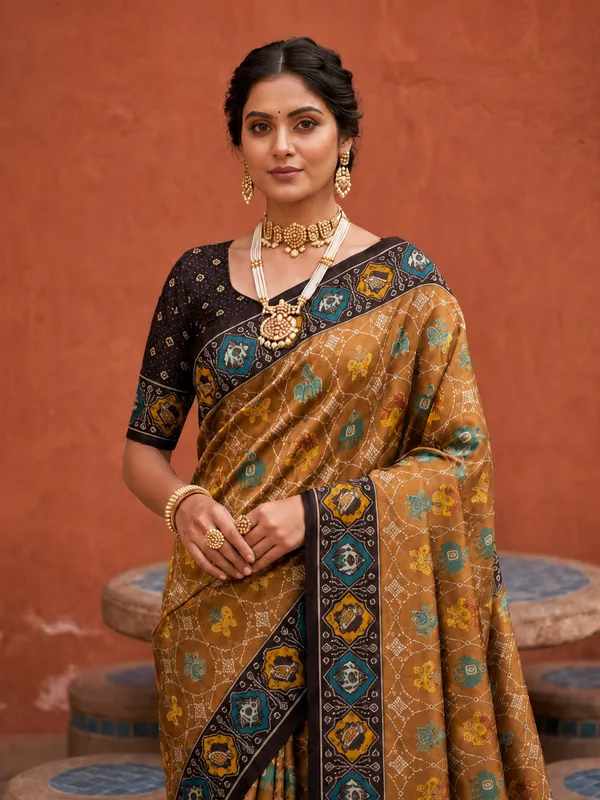 Coffee_Ajrakh_Printed_Designer_Patola_Saree_with_Contrast_Border_&_Tassel_Pallu