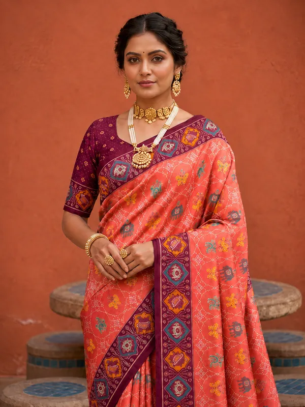 Gajri_Pink_Ajrakh_Printed_Designer_Patola_Saree_with_Contrast_Border_&_Tassel_Pallu