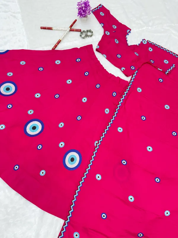 Hot_Pink_Evil_Eye_Printed_Lehenga_Choli_with_Embroidered_Dupatta