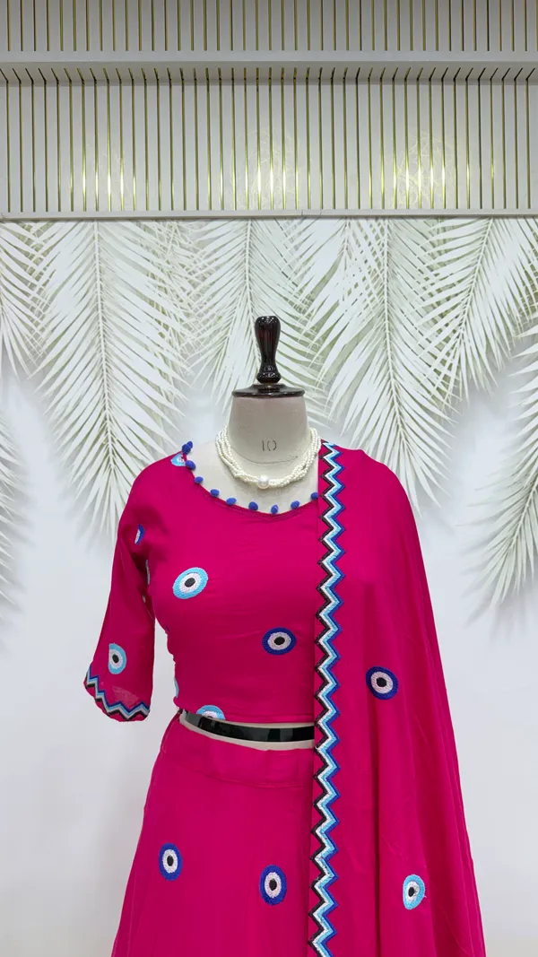 Hot_Pink_Evil_Eye_Printed_Lehenga_Choli_with_Embroidered_Dupatta