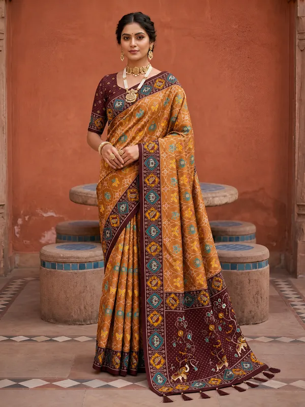Maroon_Ajrakh_Printed_Designer_Patola_Saree_with_Contrast_Border_&_Tassel_Pallu