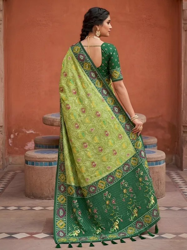 Parrot_Green_Ajrakh_Printed_Designer_Patola_Saree_with_Contrast_Border_&_Tassel_Pallu