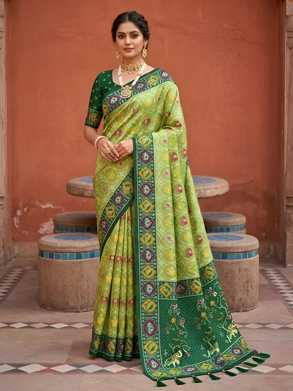 Parrot_Green_Ajrakh_Printed_Designer_Patola_Saree_with_Contrast_Border_&_Tassel_Pallu