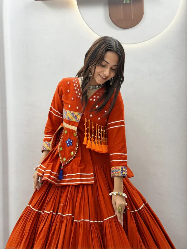 Traditional_Rust-Orange_Cotton_Navratri_Chaniya_Choli_Set_with_Koti_Jacket,_Mirror_Work_&_Gota_Patti_Accent