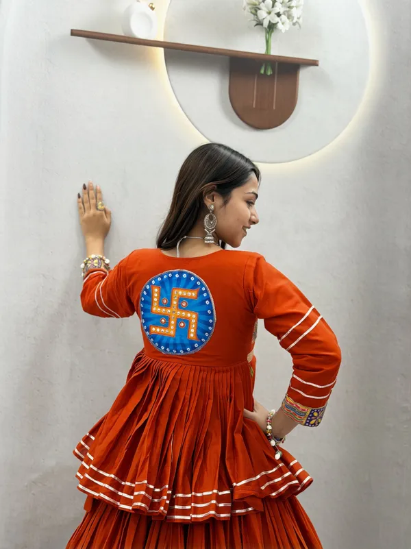 Traditional_Rust-Orange_Cotton_Navratri_Chaniya_Choli_Set_with_Koti_Jacket,_Mirror_Work_&_Gota_Patti_Accent