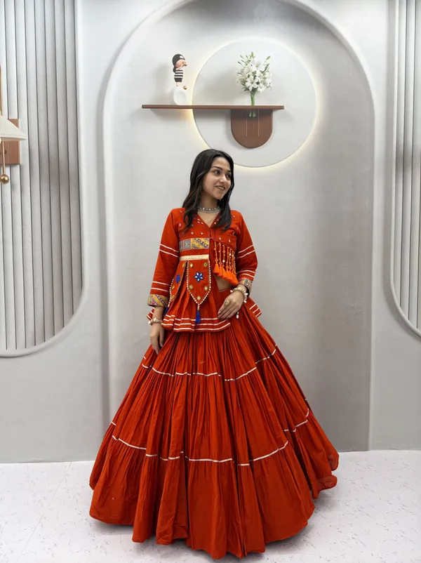 Traditional_Rust-Orange_Cotton_Navratri_Chaniya_Choli_Set_with_Koti_Jacket,_Mirror_Work_&_Gota_Patti_Accent