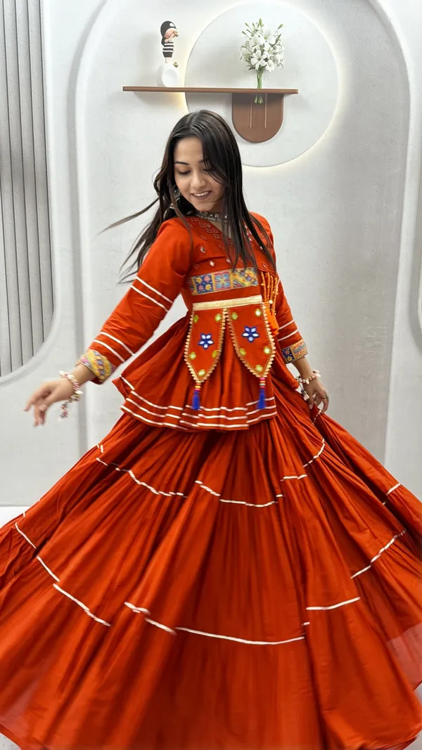 Traditional_Rust-Orange_Cotton_Navratri_Chaniya_Choli_Set_with_Koti_Jacket,_Mirror_Work_&_Gota_Patti_Accent