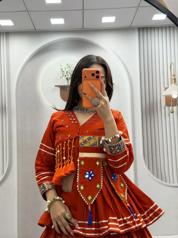 Traditional_Rust-Orange_Cotton_Navratri_Chaniya_Choli_Set_with_Koti_Jacket,_Mirror_Work_&_Gota_Patti_Accent