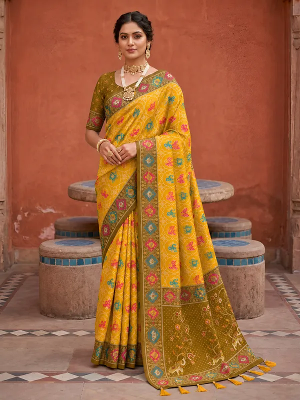 Yellow_Ajrakh_Printed_Designer_Patola_Saree_with_Contrast_Border_&_Tassel_Pallu